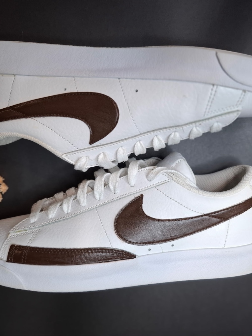 Nike Men’s White Sneakers with Brown Swoosh